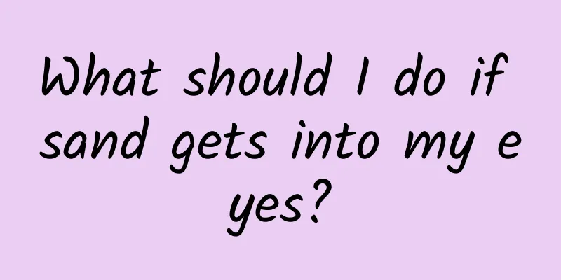 What should I do if sand gets into my eyes?